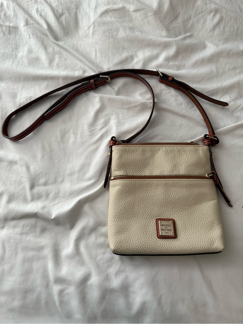 Dooney & Bourke Cream Pebbled Leather Crossbody with Brown Strap